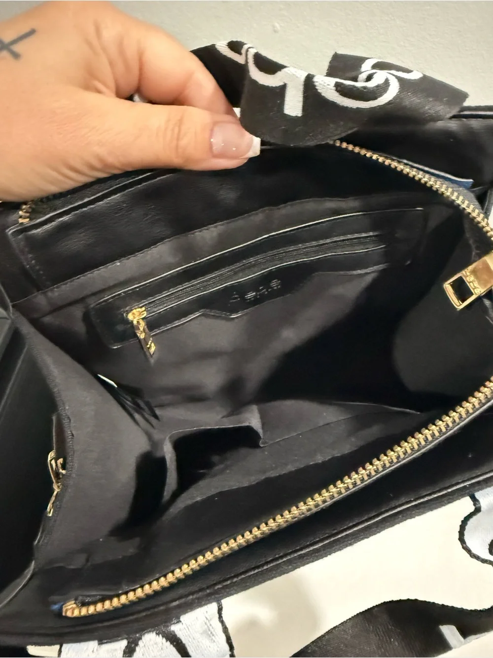 bebe Black Canvas Logo Messenger Bag with Gold Emblem